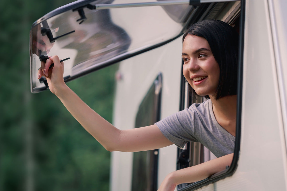 lady opening a caravan window